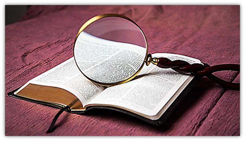 Bible and magnifying glass